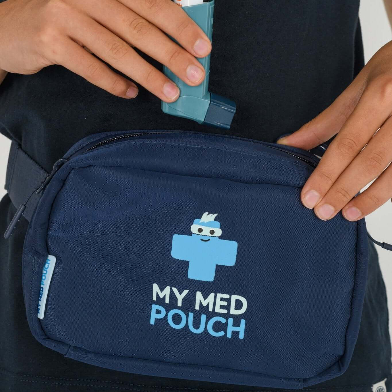 Navy Med Ready Bag being worn as a waist bag with child placing an asthma inhaler in the bag.