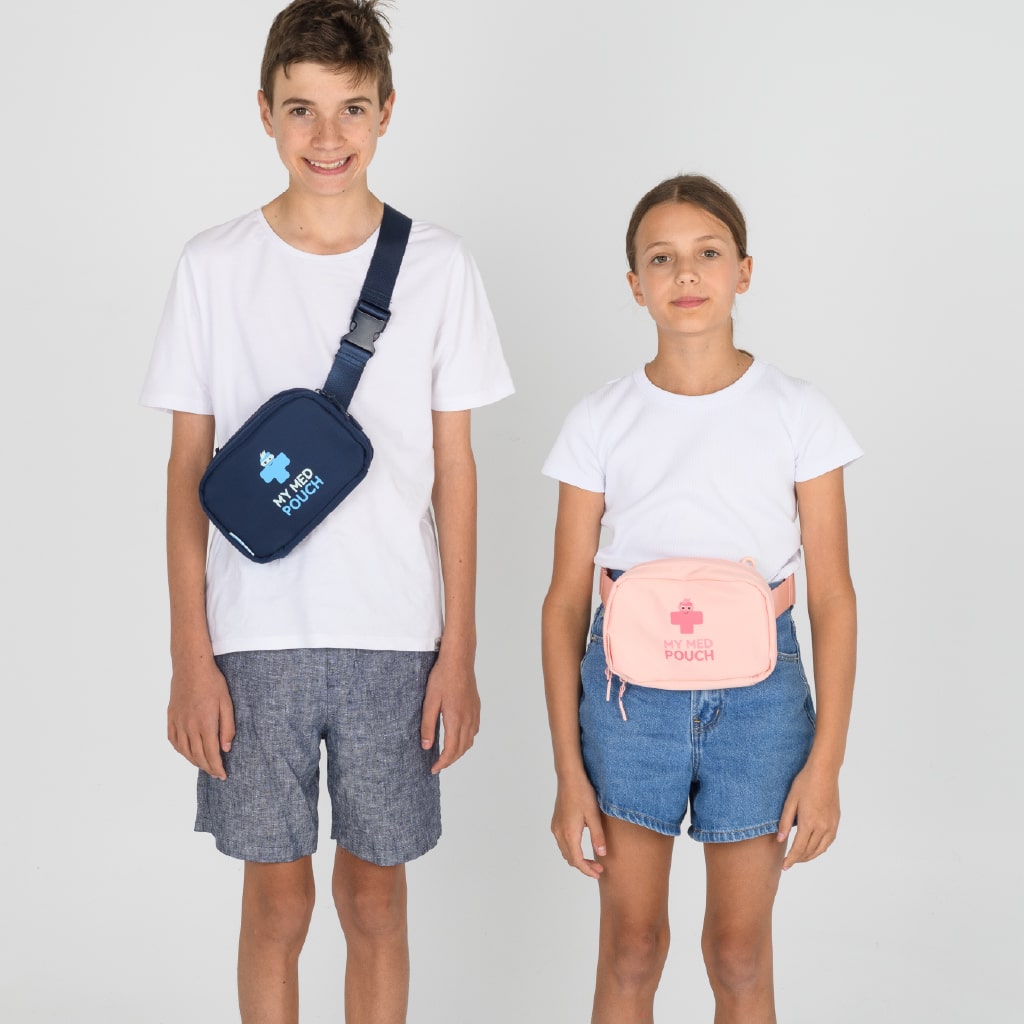 Boy wearing navy Med Ready Bag as a shoulder bag and girl wearing pink Med Ready Bag as a waist bag