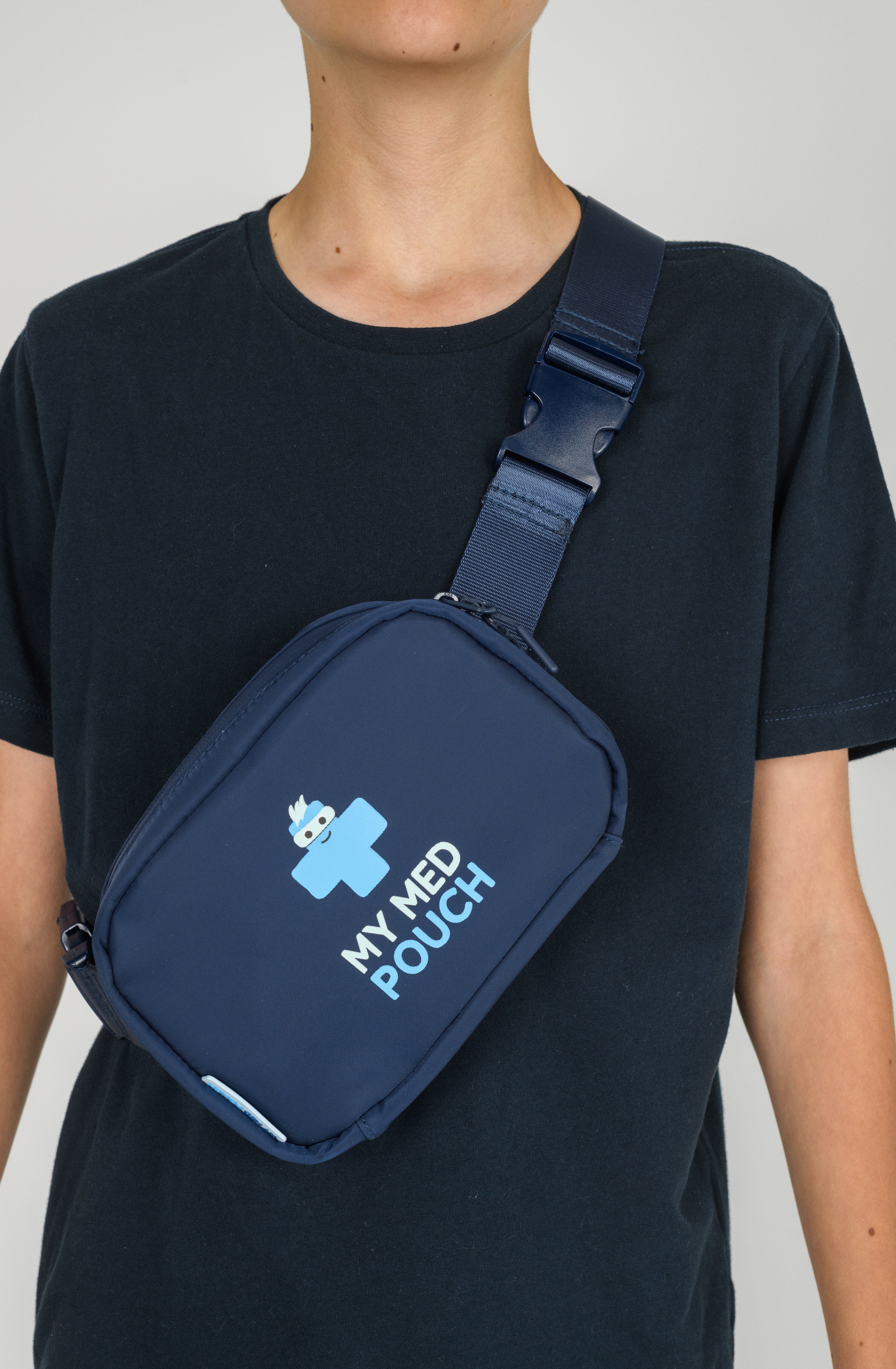 Child wearing navy Med Ready Bag as a shoulder sling